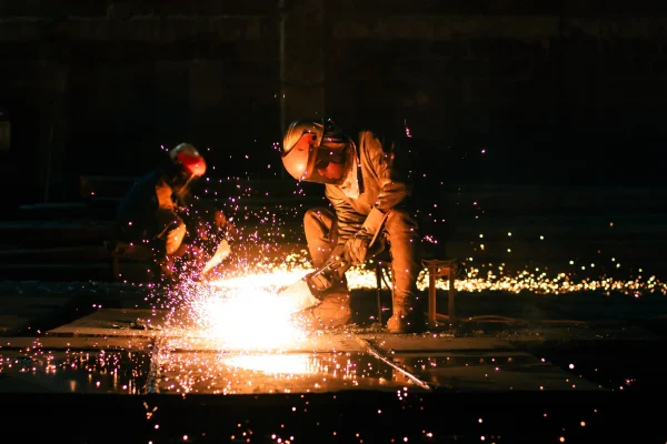 worker-cutting-steel-industrial-workplace